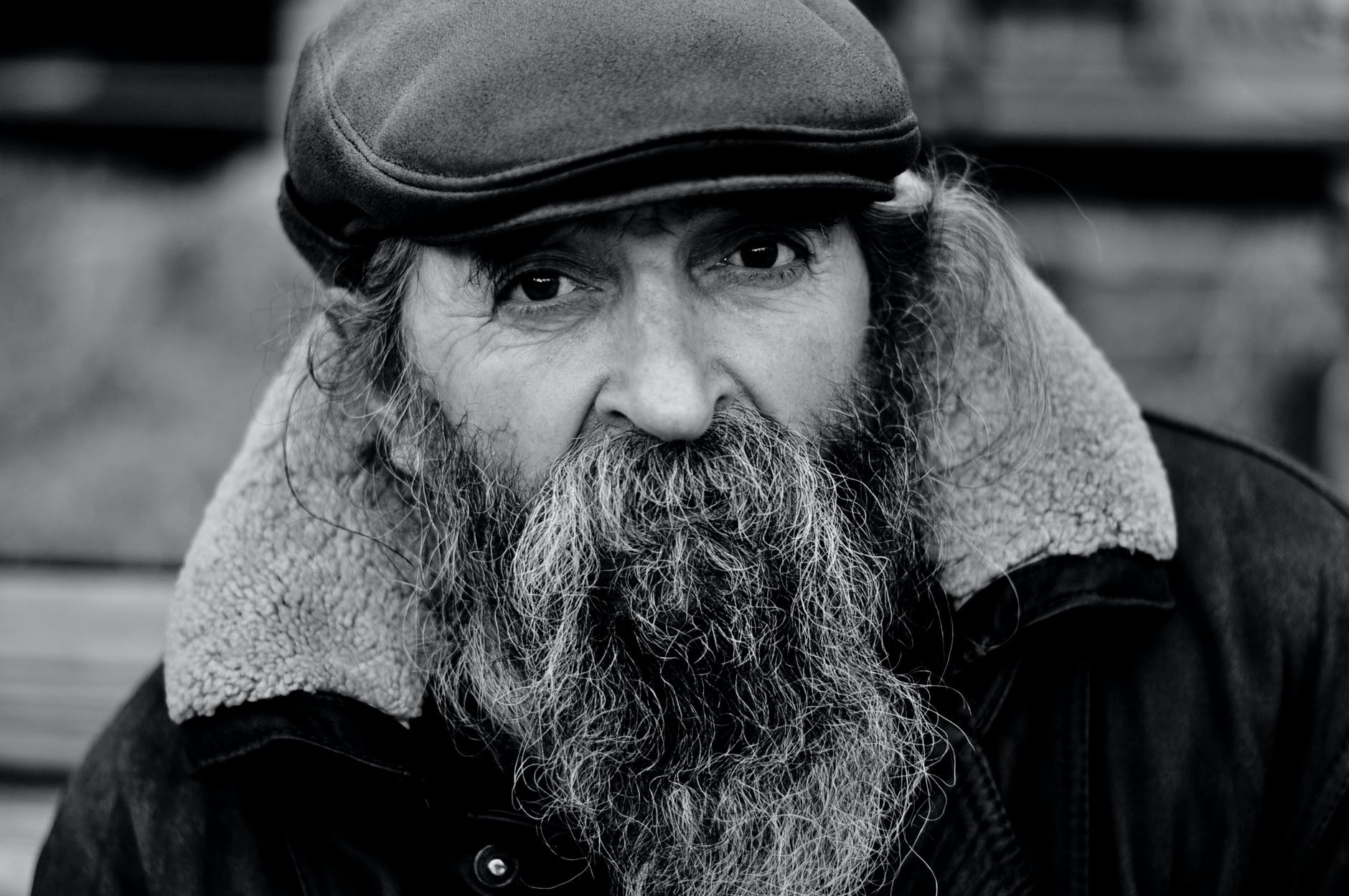 grayscale photo of man with hat