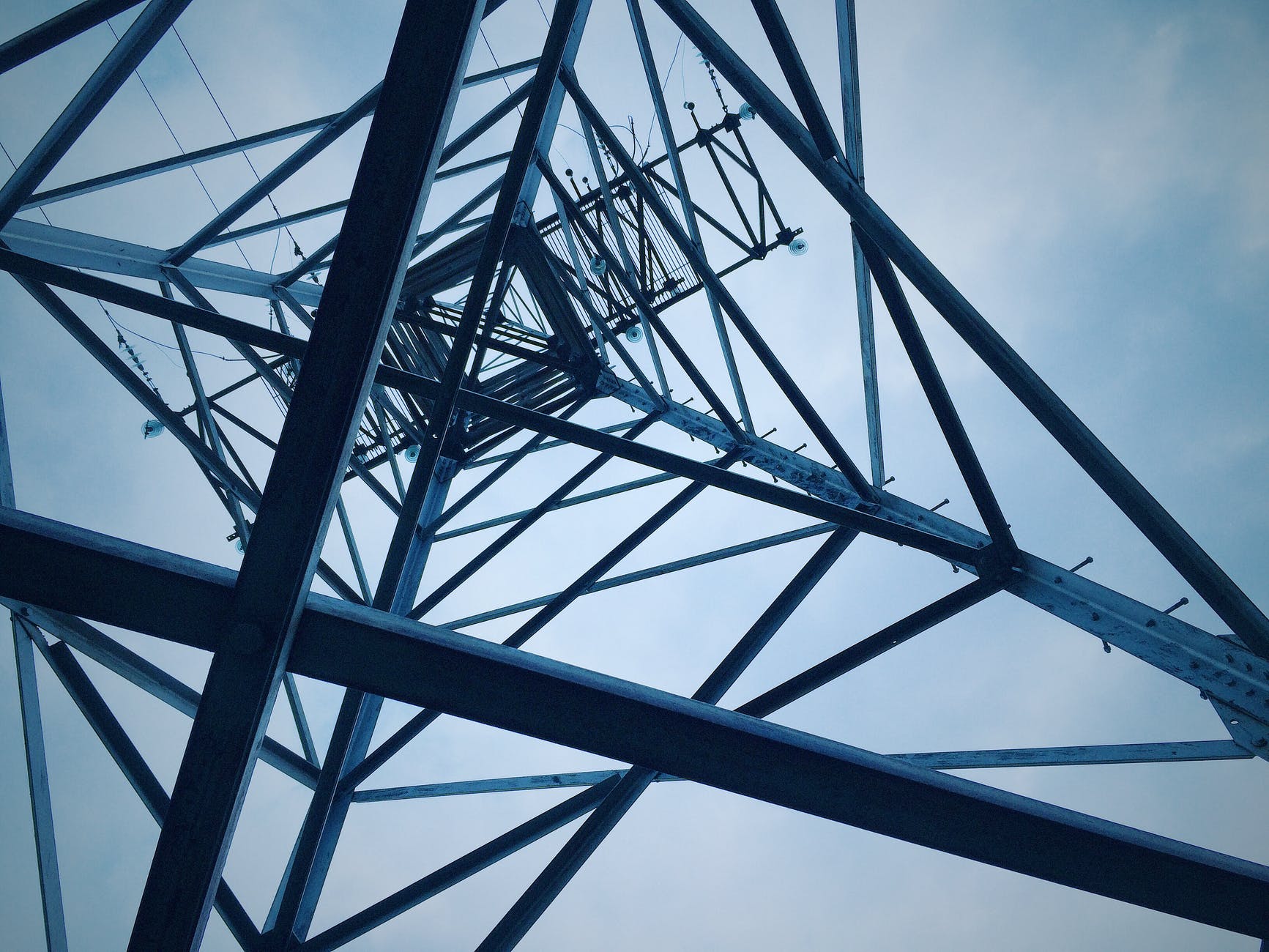 low angle view of electricity pylon against sky