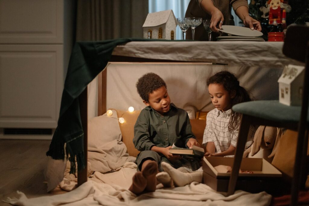 kids sitting under the table