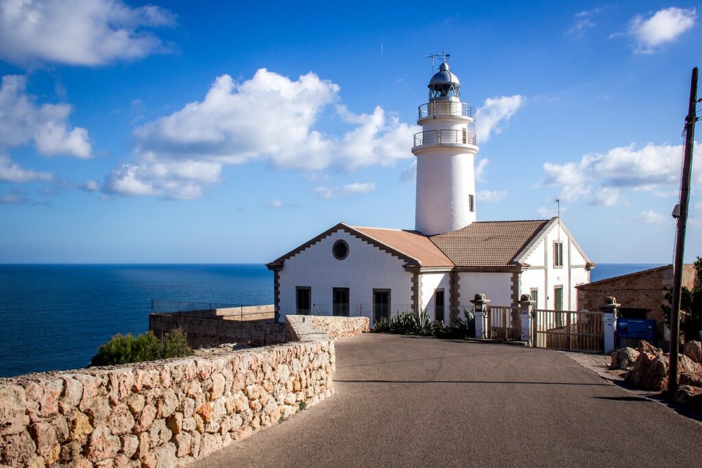 A lighthouse against a bright blue sky
