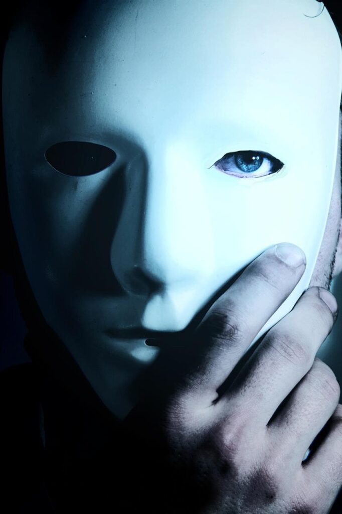 a man in a white mask