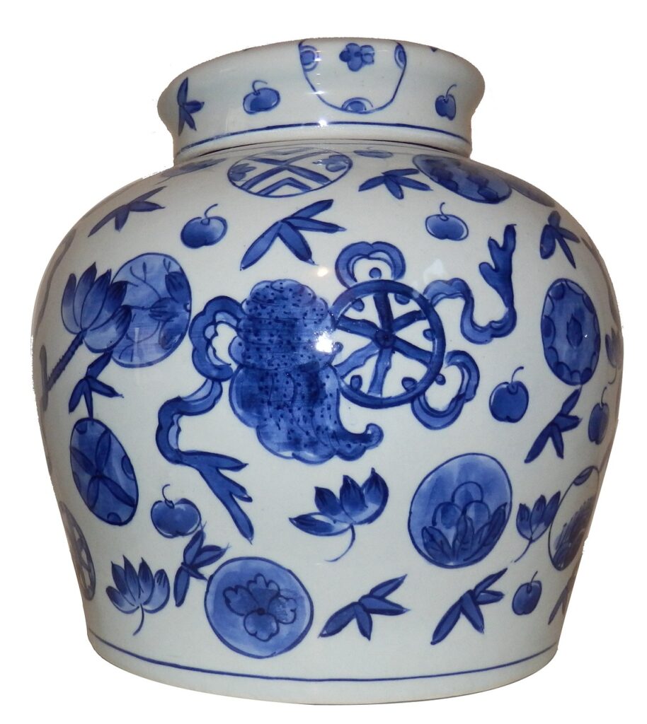 a white vase with blue decoration