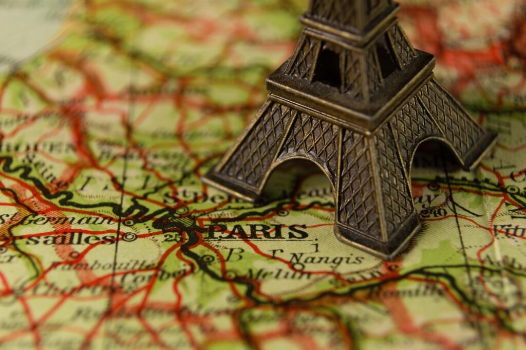 a map with a model Eiffel Tower on it